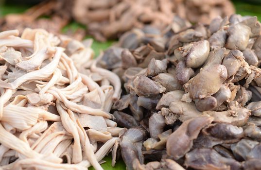 Chicken entrails on the stall, And a blurred background.