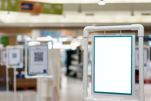Blank white indoor vinyl banner hanging on white frame for presentation. copy space.