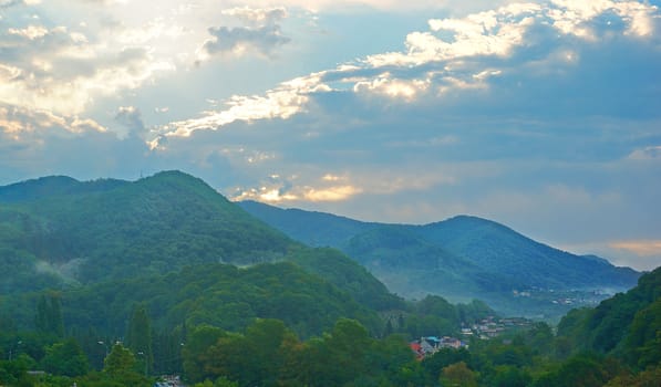 Mountain village after the rain at sunset