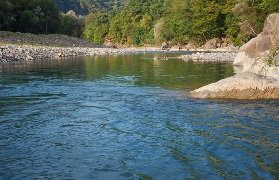 Rapid mountain river in a stone channel