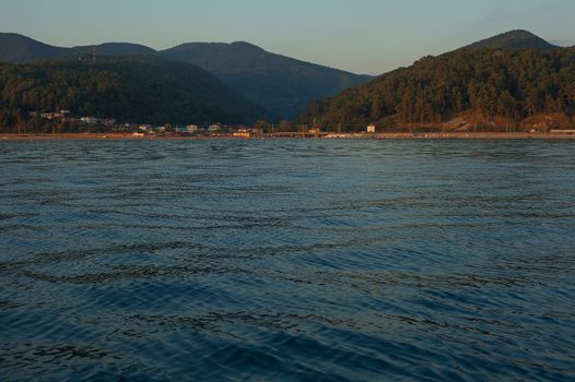 View on the mountains of Caucasus from the Black Sea at sunset