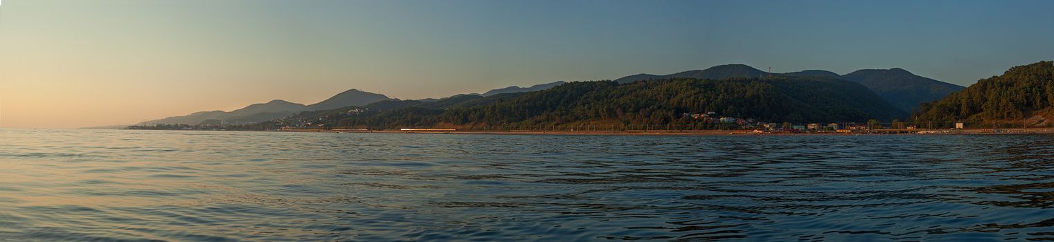 View on the mountains of Caucasus from the Black Sea at sunset