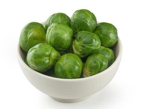 Handful of fresh green brussels sprouts in the bowl