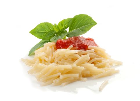 Isolated handful of boiled vermicelli with tomato sauce and fresh green basil