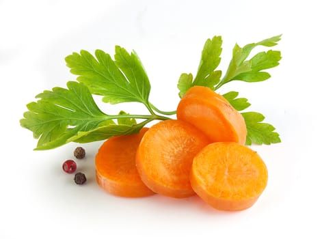 Hanfdul of orange sliced carrot with a fresh green parsley and pepper