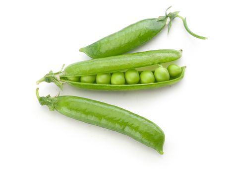 Top view of three fresh green pea pods with peas on the white background