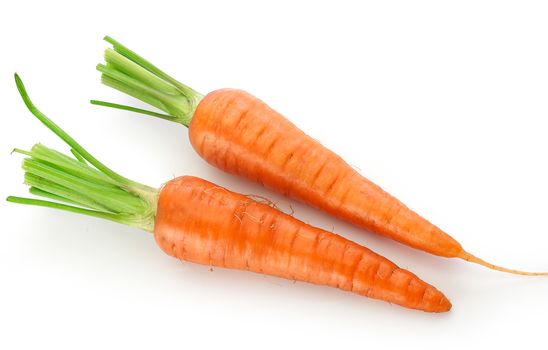 Top view of fresh whole carrots on the white background