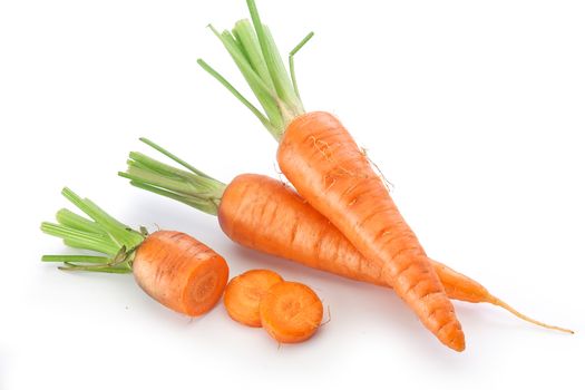 Fresh raw whole and sliced carrots on the white background