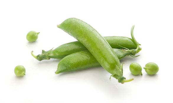 Isolated fresh green pea pods and peas on the white background