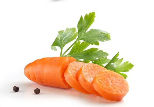 Hanfdul of orange sliced carrot with a fresh green parsley and pepper