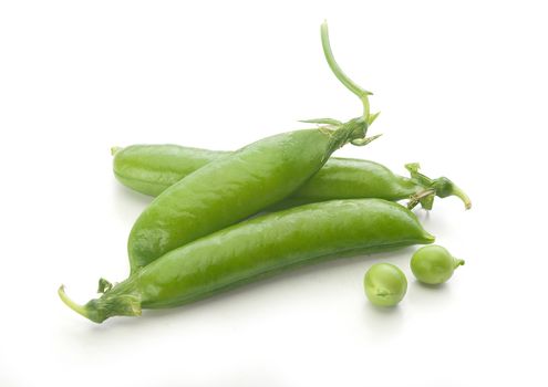 Isolated fresh green pea pods and peas on the white background