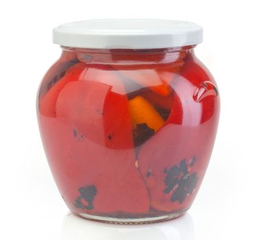 Isolated glass jar with conserved roasted red paprika