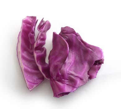 Top view of sliced piece of red cabbage on the white background