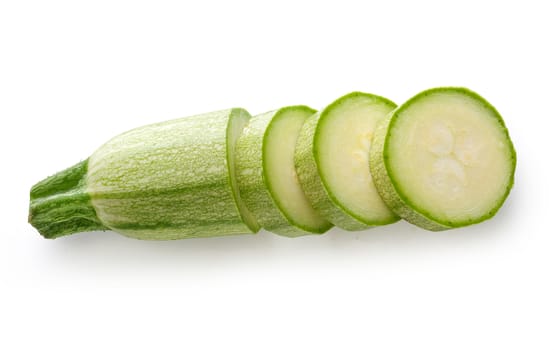 Some pieces of vegetable marrow on the white background