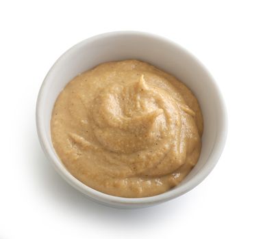 Isolated white bowl with mustard on the white background