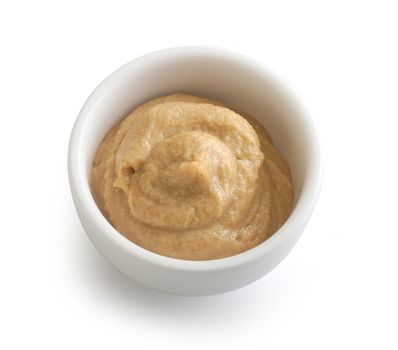 Isolated white bowl with mustard on the white background