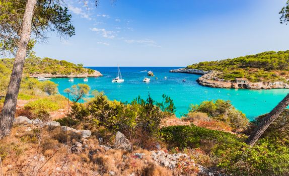 Spain Mediterranean Sea, beautiful bay with boats at Cala Mondrago on Mallorca, Balearic Islands