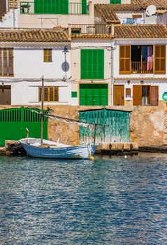 Beautiful view of old fishing boat anchored at the coast of mediterranean village on Mallorca, Spain