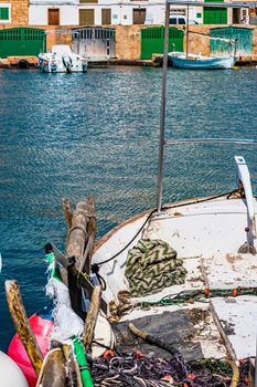 Old fishing boat anchored at coast on Majorca harbor, Spain Mediterranean Sea