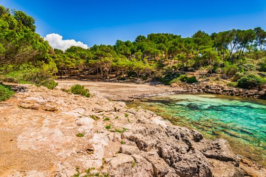 Idyllic bay beach of Calo de sa Barca Trencada at the seaside of Santanyi on Mallorca island, Spain