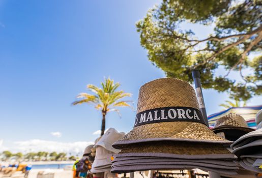Summer sun hat, head accessory and souvenir on Mallorca island, Spain Mediterranean Sea