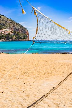 Sand beach volleyball net at beautiful seaside coast of Mallorca island, Spain