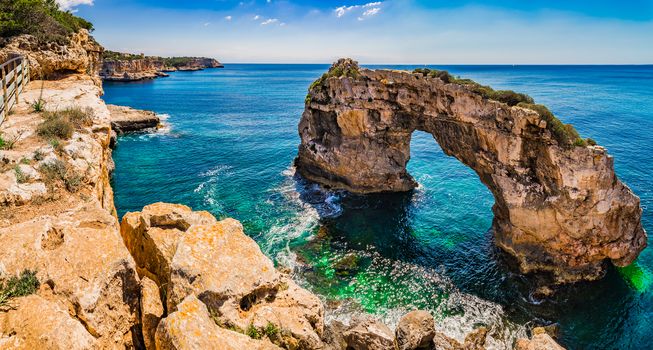 Beautiful view of natural arch Es Pontas at the coast on Mallorca island, Spain
