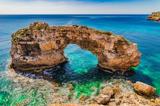 Beautiful view of natural arch Es Pontas at the coast on Mallorca island, Spain