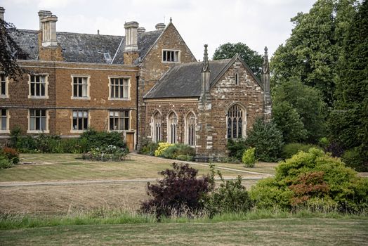 UK, Launde Abbey, Leicestershire - July 2018: Once home to the Cromwell Family and now a christian retreat Launde Abbey was founded 1119 by Richard Basset, a royal official of Henry I. Rear & chapel.