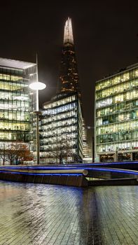 London, UK - Jan 2020: The Shard and The Scoop on a dark wet night
