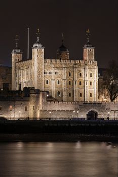 London, UK - Jan 2020: The Tower of London at night next to the River Thames
