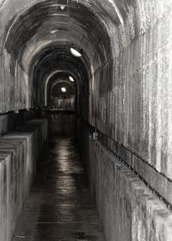 France, Alsace, June 2015: Tunnel connecting underground constructions at Fort de Mutzig, Fortress of Kaiser Willheim II, Dutch Tilt, B&W