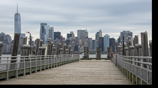 USA, New York, Liberty Island - May 2019:View of downtown Manhattan from old dock on Liberty Island