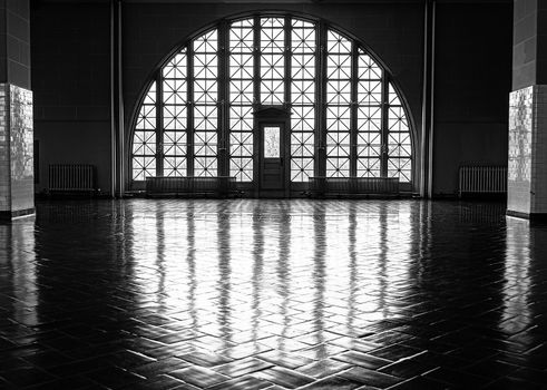 USA, New York, Ellis Island - May 2019: Arched windows in the upper hall at Ellis Island Immigrant processing building