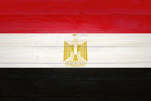 Egypt flag painted on old wood plank background. Brushed natural light knotted wooden planks board texture. Wooden texture background flag of Egypt