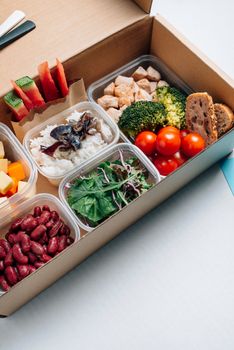 Healthy food in lunch box, minimal concept of eating at workplace. Balanced nutrition based on macro-nutrients, protein hydrates and fats. Home food for office concept