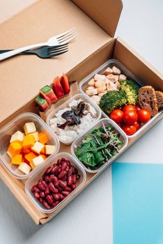 Healthy food in lunch box, minimal concept of eating at workplace. Balanced nutrition based on macro-nutrients, protein hydrates and fats. Home food for office concept