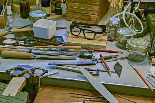 FRANCE, STRASBOURG - JUNE, 2015: Work bench in a glasses shop. The optician here not only tests you eyes but he then handcrafts your eyewear. 