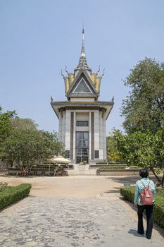 Cambodia, Phnom Phen - Mar 2016: A survivor of the Khmer Rouge campaign visits the killing fields memorial.