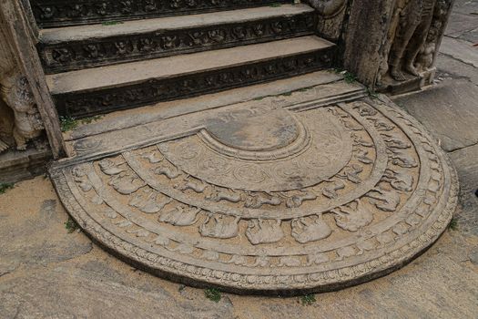 Polonnaruwa, Sri lanka: Moonstone representing birth, decay, disease and death, floor carvings found at entries to religious sites