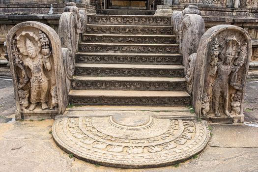 Polonnaruwa, Sri lanka: Moonstone representing birth, decay, disease and death, floor carvings found at entries to religious sites
