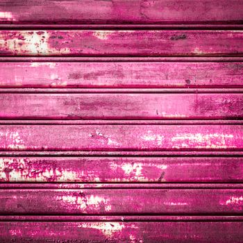 Retro colored background with noise effect; grunge texture with pink/fuchsia color pattern