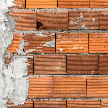 Wall with old brick and mortar bed.