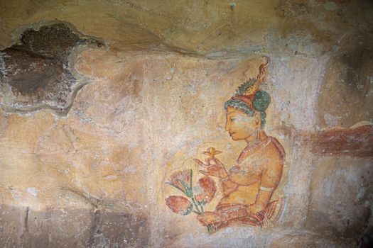 Sri Lanka, Sigiriya - August 2015: Famous paintings preserved on the gallery wall at the ancient royal place,  perched on top of the Rock