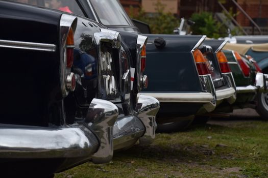 UK, Quorn - May  2015: Rear end view on a row of Triumph Heralds.	