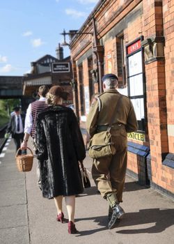 UK, Quorn - June 2015: People in war time dress on train platform