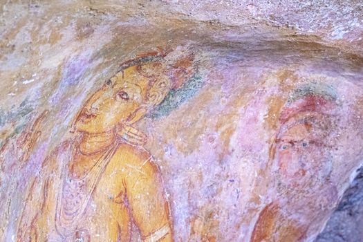 Sri Lanka, Sigiriya - August 2015: Famous paintings preserved on the gallery wall at the ancient royal place,  perched on top of the Rock