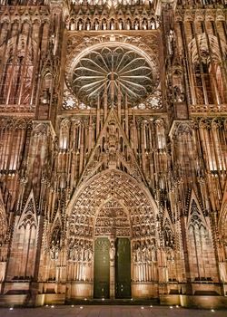 France, Alsace - March 2018: Illuminated facade of the cathedral of Notre Dame in Strasbourg at night
