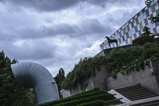 France, Alsace, June 2015: Strasbourg Museum of modern art under an over cast sky - dutch tilt