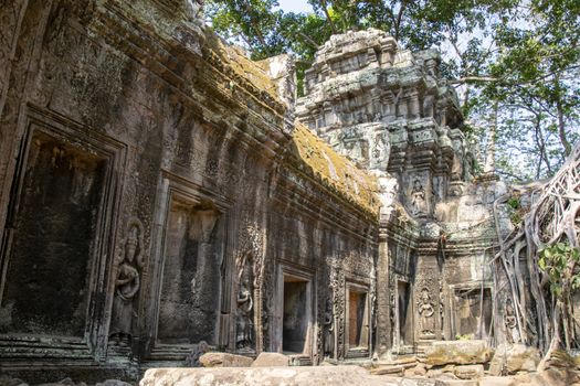 Cambodia, Siem Riep- March 2016: Ta Phrohm temple and these statues, have been recovered from the Jungle are partially rebuilt by archeologists